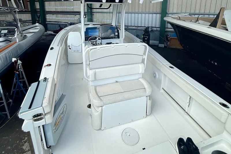 Slide: The Image of 2023 Sea Hunt Ultra 265 SE boat interior with seating and control panel. - 7