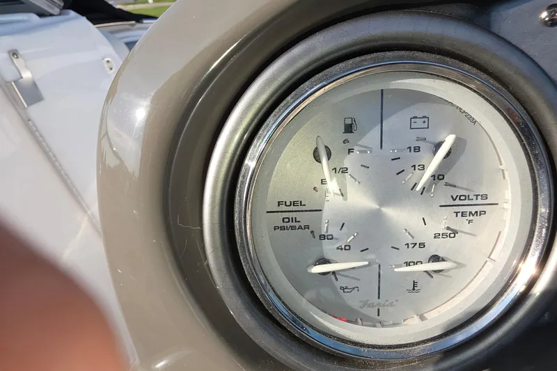 Slide: The Image of Close-up of 2013 Rinker 276 Captina boat gauge panel displaying fuel, volts, oil, and temperature. - 11