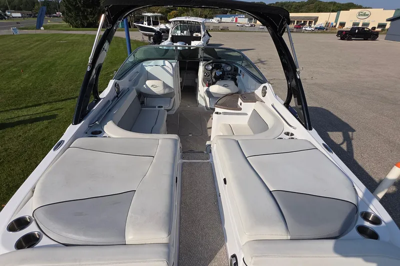 Slide: The Image of 2013 Rinker 276 Captina boat interior with spacious seating and modern dashboard. - 19