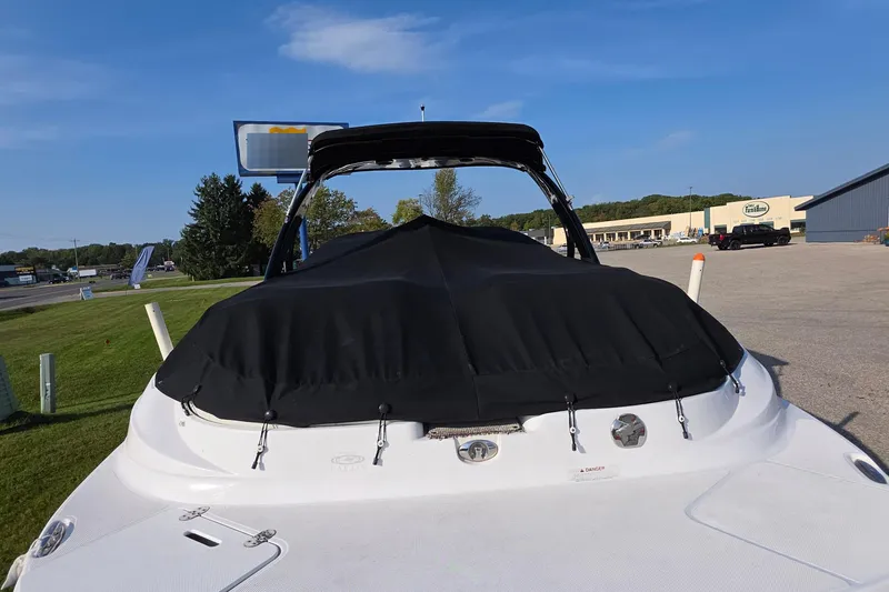 Slide: The Image of 2013 Rinker 276 Captina boat with black cover at Walstrom Marine dealership. - 21