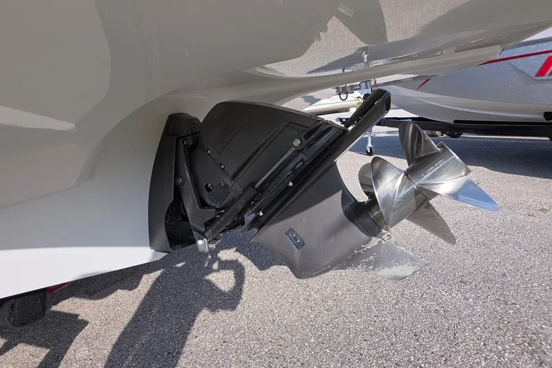 Slide: The Image of 2013 Rinker 276 Captina boat propeller and outdrive close-up. - 43