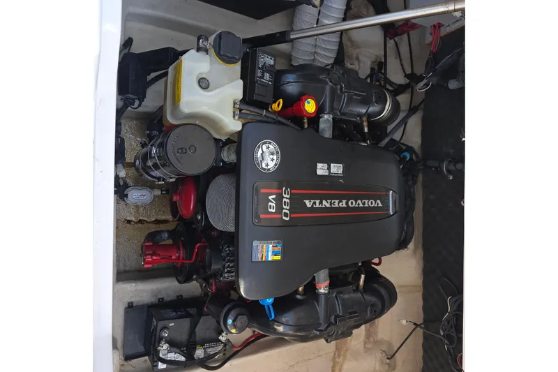 Slide: The Image of Volvo Penta V8 engine in 2013 Rinker 276 Captina boat, showcasing mechanical components. - 48