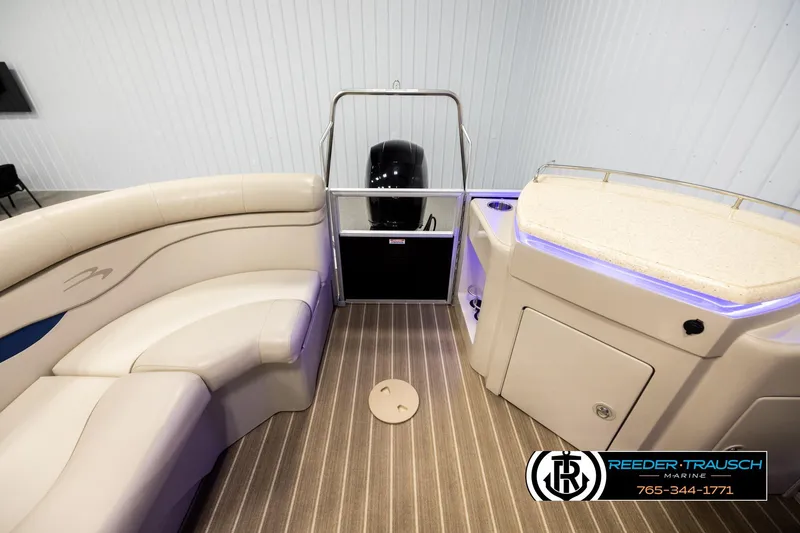 Slide: The Image of 2016 Bennington 24 SPDXDF boat interior with seating and console, featuring modern design. - 15