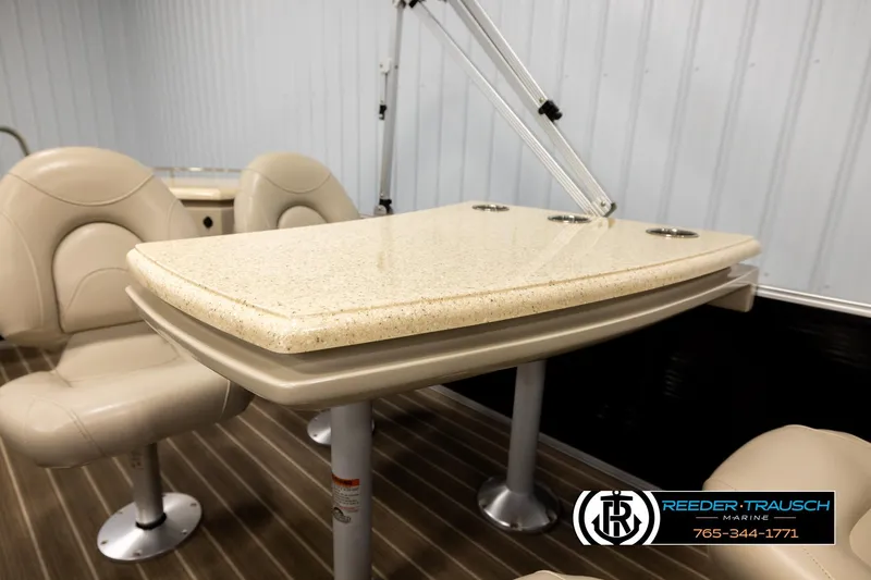 Slide: The Image of Interior of 2016 Bennington 24 SPDXDF boat with beige seating and table. - 23