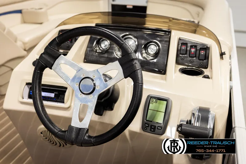 Slide: The Image of Steering console of a 2016 Bennington 24 SPDXDF boat with gauges and controls. - 29