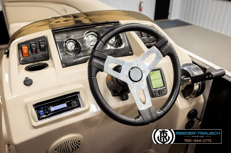Slide: The Image of 2016 Bennington 24 SPDXDF boat dashboard with steering wheel and control panel. - 30