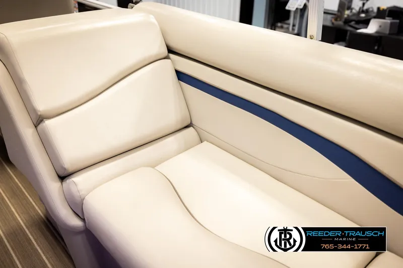 Slide: The Image of 2016 Bennington 24 SPDXDF boat interior seating with beige and blue accents. - 41