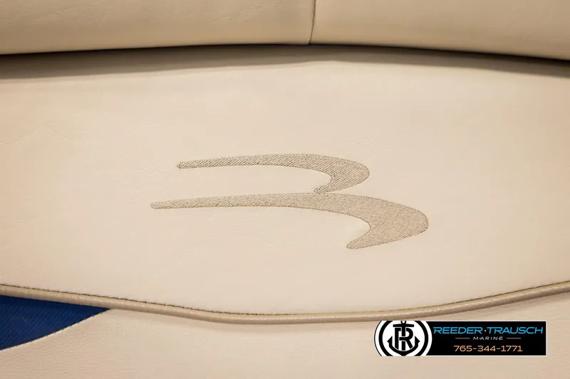 Slide: The Image of 2016 Bennington 24 SPDXDF boat seat with logo, Reeder-Trausch Marine contact details. - 42