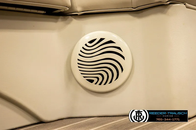 Slide: The Image of Speaker grille on 2016 Bennington 24 SPDXDF boat interior, featuring Reeder-Trausch Marine logo. - 46