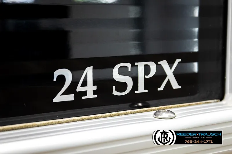 Slide: The Image of Close-up of 2016 Bennington 24 SPDXDF boat model lettering and Reeder-Trausch Marine logo. - 55