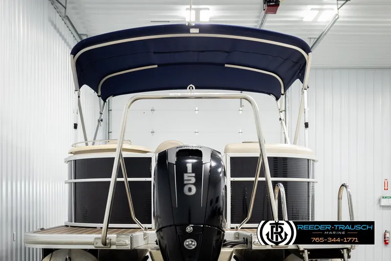 Slide: The Image of 2016 Bennington 24 SPDXDF pontoon boat with 150 HP engine in a showroom. - 7