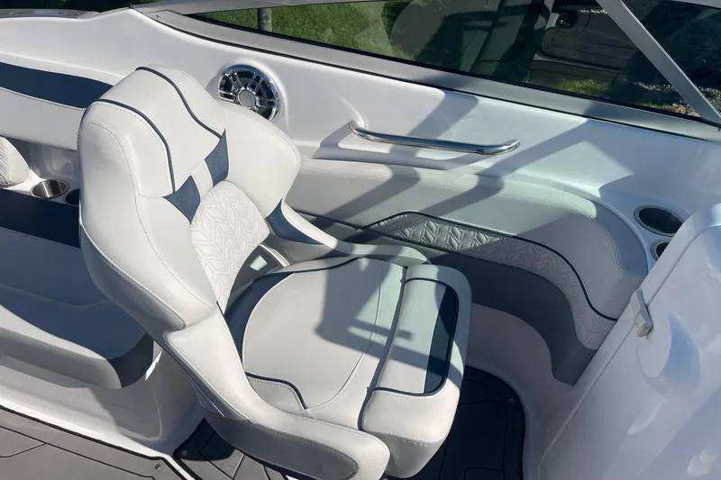 Slide: The Image of 2023 Hurricane SunDeck 2400 OB boat interior with white seating and modern design. - 11