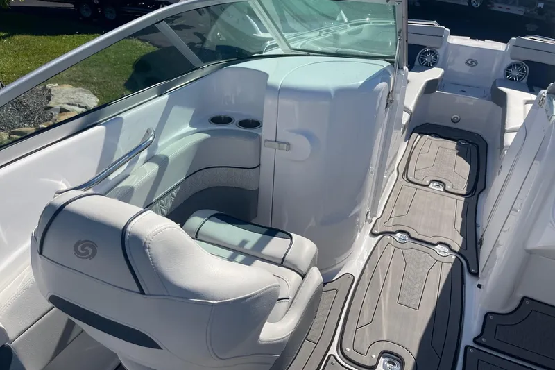 Slide: The Image of 2023 Hurricane SunDeck 2400 OB boat interior with seating and cup holders. - 12