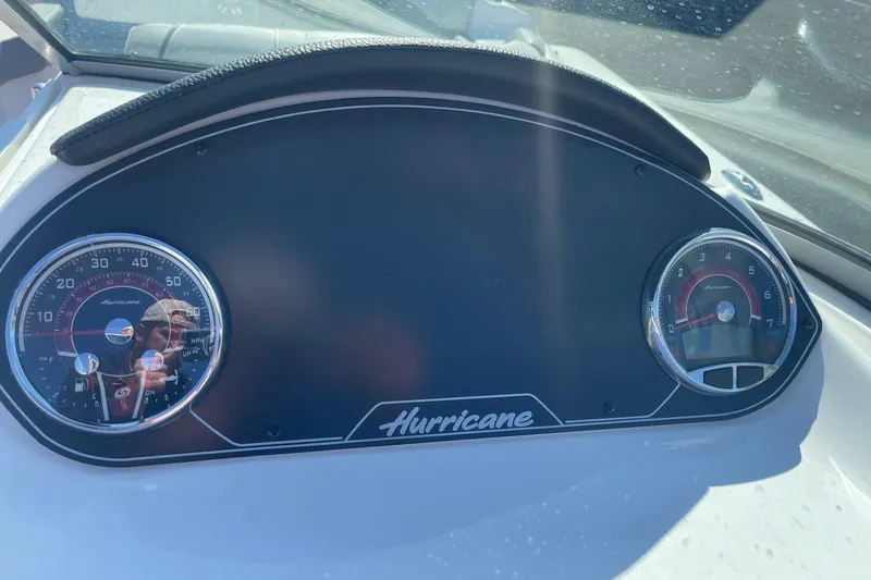 Slide: The Image of Dashboard of 2023 Hurricane SunDeck 2400 OB boat with speedometer and tachometer. - 17