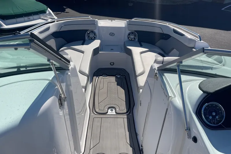 Slide: The Image of 2023 Hurricane SunDeck 2400 OB boat interior with seating and dashboard view. - 24