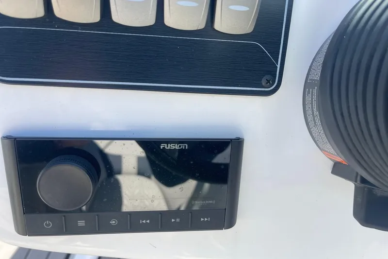 Slide: The Image of Fusion audio system on 2023 Hurricane SunDeck 2400 OB boat dashboard. - 29