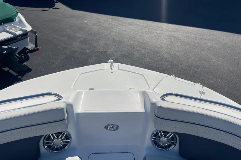 Slide: The Image of 2023 Hurricane SunDeck 2400 OB boat deck with seating and speakers in sunlight. - 30