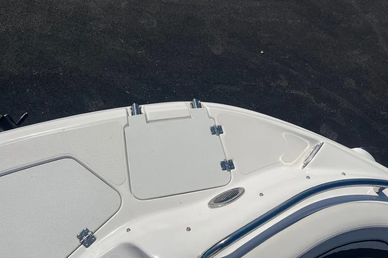 Slide: The Image of 2023 Hurricane SunDeck 2400 OB boat deck with sleek white finish and stainless steel accents. - 31