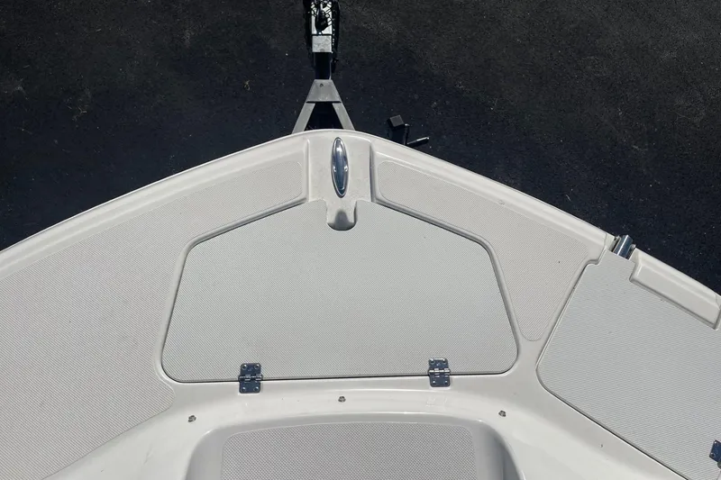 Slide: The Image of 2023 Hurricane SunDeck 2400 OB boat deck with storage compartment and sleek design. - 32