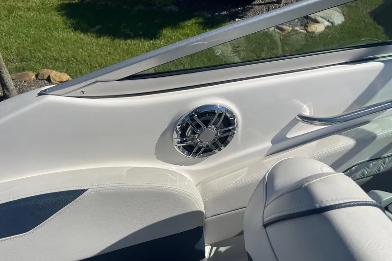 Slide: The Image of Interior of 2023 Hurricane SunDeck 2400 OB boat with speaker and seating. - 35