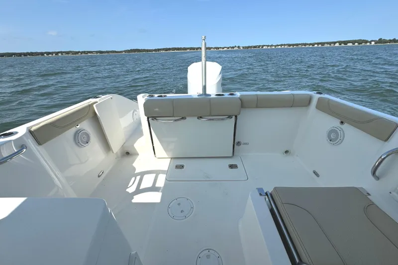 Slide: The Image of 2020 Pursuit DC 235 Dual Console boat with foldable seat and teak flooring. - 15