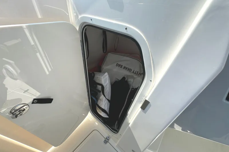 Slide: The Image of Control panel on 2020 Pursuit DC 235 Dual Console boat, featuring switches and circuit breakers. - 22