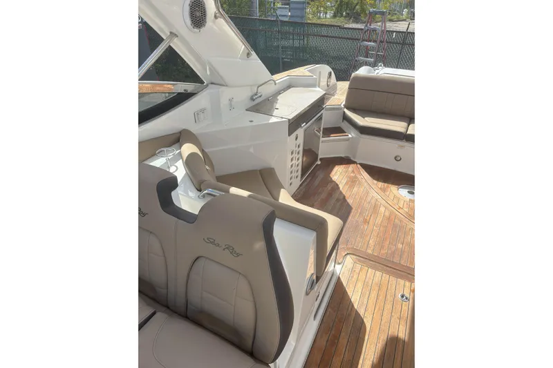 Slide: The Image of Interior of 2016 Sea Ray 350 SLX boat with luxurious seating and wooden flooring. - 10