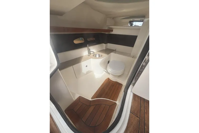Slide: The Image of Luxurious 2016 Sea Ray 350 SLX boat bathroom with wooden flooring and modern fixtures. - 18