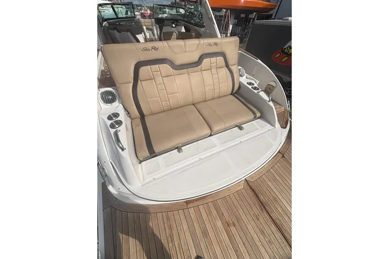 Slide: The Image of 2016 Sea Ray 350 SLX boat with tan leather seating and wooden deck. - 27