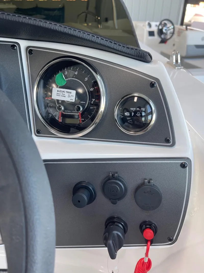 Slide: The Image of Dashboard of 2023 Hurricane SunDeck Sport 192 RL OB boat with gauges and controls. - 11