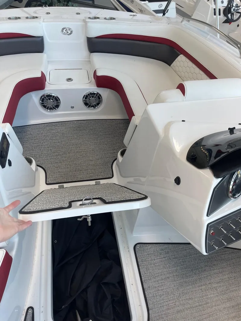 Slide: The Image of 2023 Hurricane SunDeck Sport 192 RL OB boat interior with seating and storage. - 14