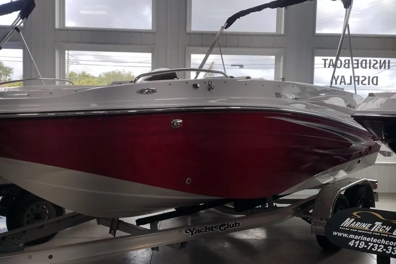 Slide: The Image of 2023 Hurricane SunDeck Sport 192 RL OB boat on display in showroom. - 2