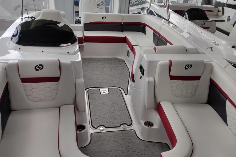 Slide: The Image of 2023 Hurricane SunDeck Sport 192 RL OB interior with white and red seating. - 3