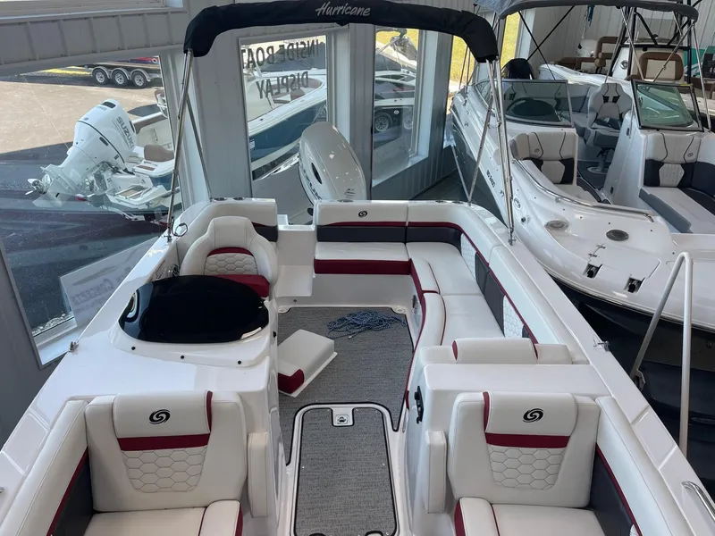 Slide: The Image of 2023 Hurricane SunDeck Sport 192 RL OB boat interior with white and red seating. - 6