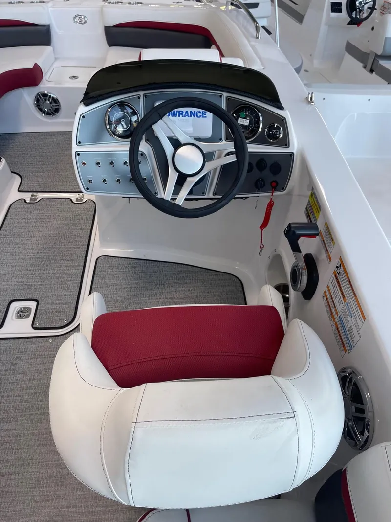 Slide: The Image of 2023 Hurricane SunDeck Sport 192 RL OB boat interior with steering wheel and seating. - 7