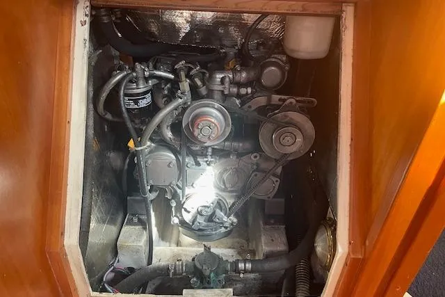 Slide: The Image of Engine compartment of a 2001 Tartan 3700 sailboat, showcasing mechanical components and wiring. - 20