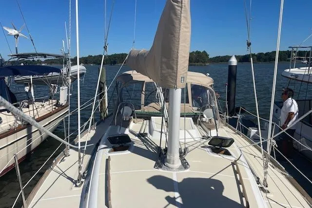 Slide: The Image of Sailboat docked at marina, Tartan 3700 model, 2001, with clear blue sky. - 22
