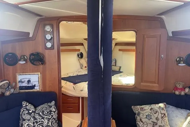 Slide: The Image of Interior of 2001 Tartan 3700 sailboat with cozy cabin and nautical decor. - 4