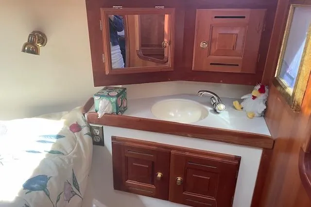 Slide: The Image of Cozy Tartan 3700 yacht interior with wooden cabinets and sink, 2001 model. - 6