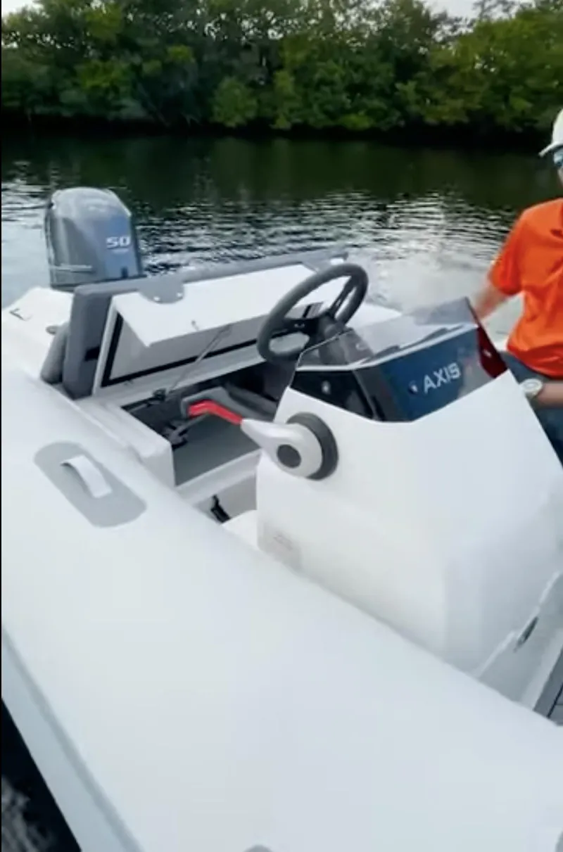 Slide: The Image of 2023 Northstar Axis 3.8 boat on water, featuring sleek design and modern controls. - 4