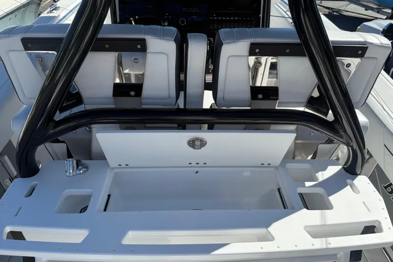 Slide: The Image of 2022 Blackfin 272 CC boat interior with seating and storage area. - 10