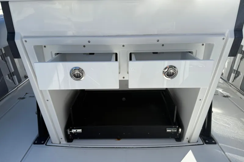 Slide: The Image of 2022 Blackfin 272 CC boat storage drawers and compartment detail. - 11