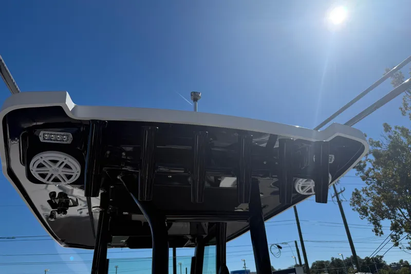 Slide: The Image of 2022 Blackfin 272 CC boat top view under clear blue sky. - 13