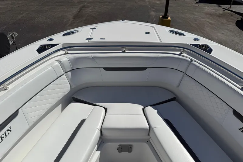 Slide: The Image of 2022 Blackfin 272 CC boat interior with white cushioned seating. - 3