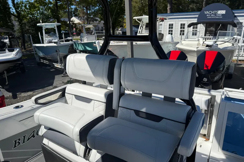 Slide: The Image of 2022 Blackfin 272 CC boat with dual cushioned seats and sleek design. - 9