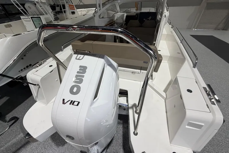 Slide: The Image of 2025 Nimbus Weekender 9 boat with Mercury 350 V10 engine, sleek design, spacious seating. - 4