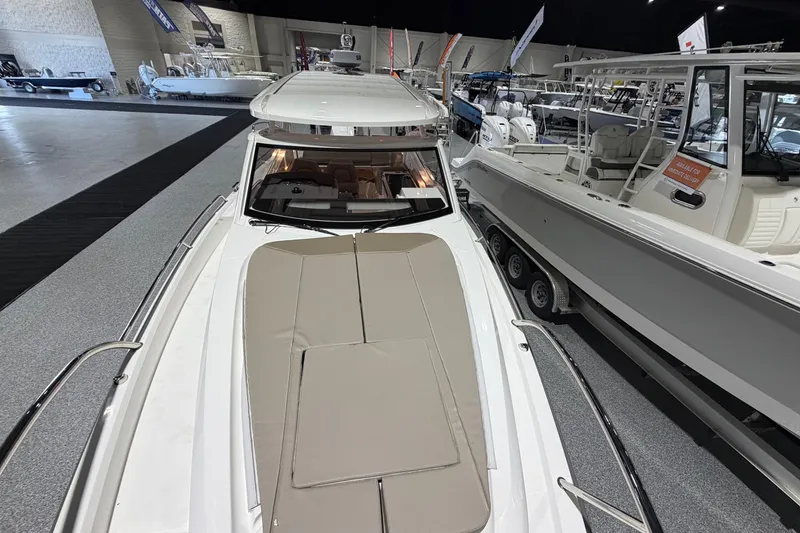 Slide: The Image of 2025 Nimbus Weekender 9 boat displayed at an indoor boat show. - 6