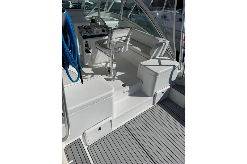 Slide: The Image of 2001 Luhrs Tournament 320 Open boat cockpit with seating and steering wheel. - 6