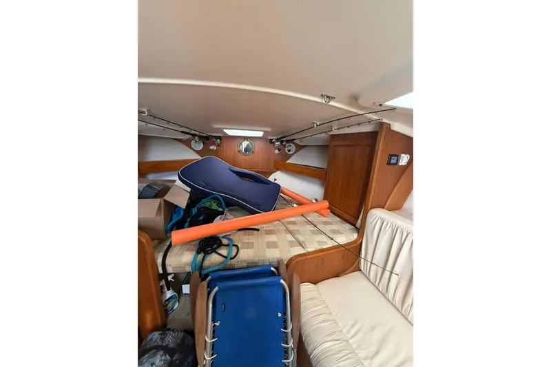 Slide: The Image of Interior of 2001 Luhrs Tournament 320 Open boat with fishing gear and seating. - 9