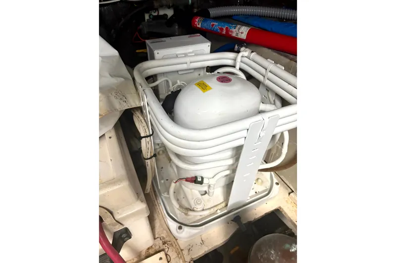 Slide: The Image of Engine compartment of a 1993 Tiara Yachts 43 Open, showcasing mechanical components. - 24